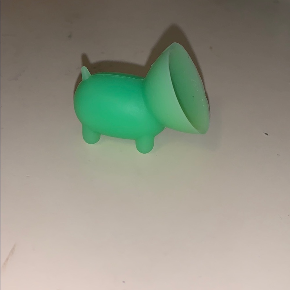 Green piggy phone stand